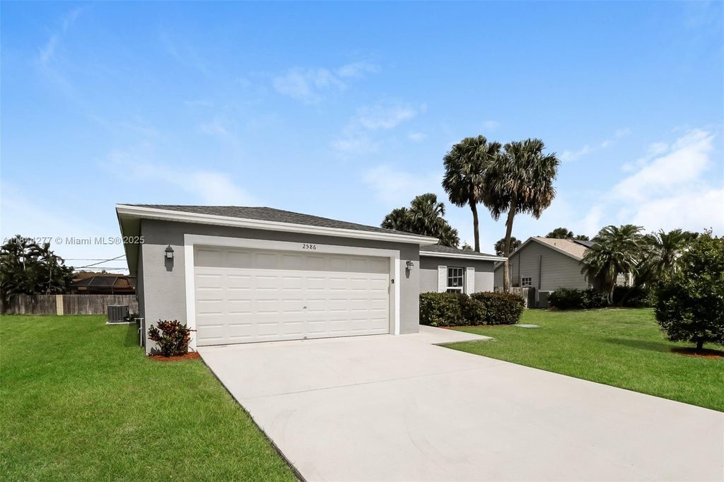 Photo of 2586 SW Dawn St, Port St Lucie, FL 34953 (MLS # A11844277)