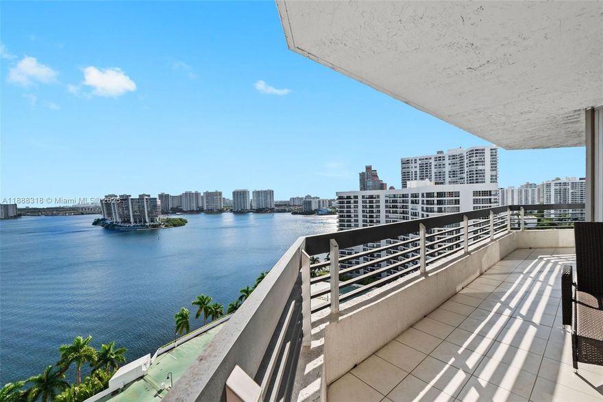 Experience breathtaking, unobstructed views of the Intracoastal Waterway and Sunny Isles Beach from this spacious 2-bedroom, 2-bath residence at Mystic Pointe Tower 200. This highly sought-after line features a wraparound balcony accessible from the living room and kitchen, offering endless natural light and stunning panoramas. The master suite includes a generous walk-in closet and electrical blinds, also found in the living room. Kitchen cabinetry is in excellent condition, ready to move in or upgrade to your taste. Enjoy resort-style living with valet service, assigned covered parking, pool, fitness center, tennis courts, and 24-hour security. An unbeatable lifestyle in Aventura, minutes from beaches, Aventura Mall, and fine dining. Easy to show.