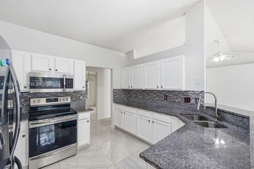 Photo of 7608 Deland Ave, Fort Pierce, FL 34951 (MLS # A12018077)