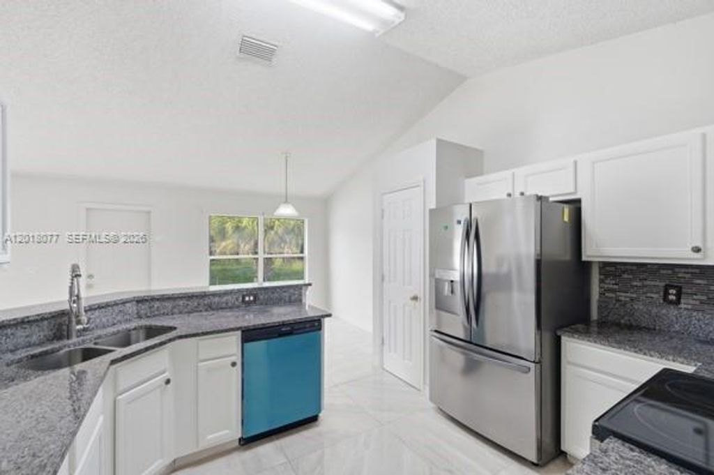 Photo of 7608 Deland Ave, Fort Pierce, FL 34951 (MLS # A12018077)