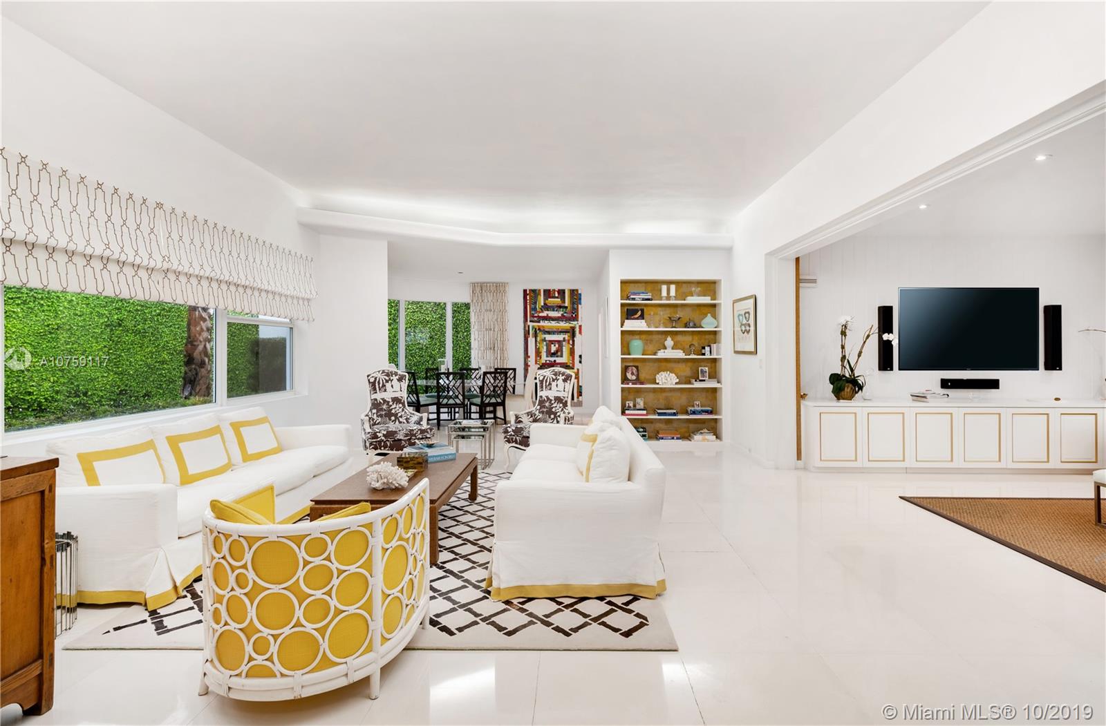 Located at the end of upper N. Bay Rd, adjacent to La Gorce Island and a charming neighborhood park, this 5 BD 4.5 BA home sits on a large 11,600 sqft lot. Originally designed by architect Donald Smith, this perfectly restored Mid-Century Modern home features limestone floors throughout. This private residence offers intricate built ins, a formal dining and living area, an attached two car garage, and is complimented with over-sized impact windows which offer abundant natural light. Gourmet eat-in kitchen, top-of-the-line appliances, including a Wolf gas range and Sub-zero refrigerator. Elegant master suite features dual sinks, a spacious walk-in shower and walk-in closet. This tranquil home is finished with a spacious backyard and a heated pool/spa.