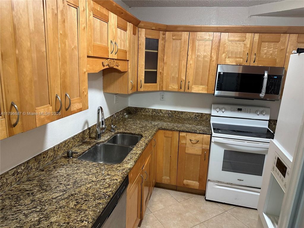 Photo of 4394 NW 9th Ave #21-3C, Deerfield Beach, FL 33064 (MLS # A11796687)