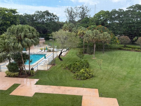Photo of 900 Saint Charles Pl #407, Pembroke Pines, FL 33026 (MLS # A12040555)