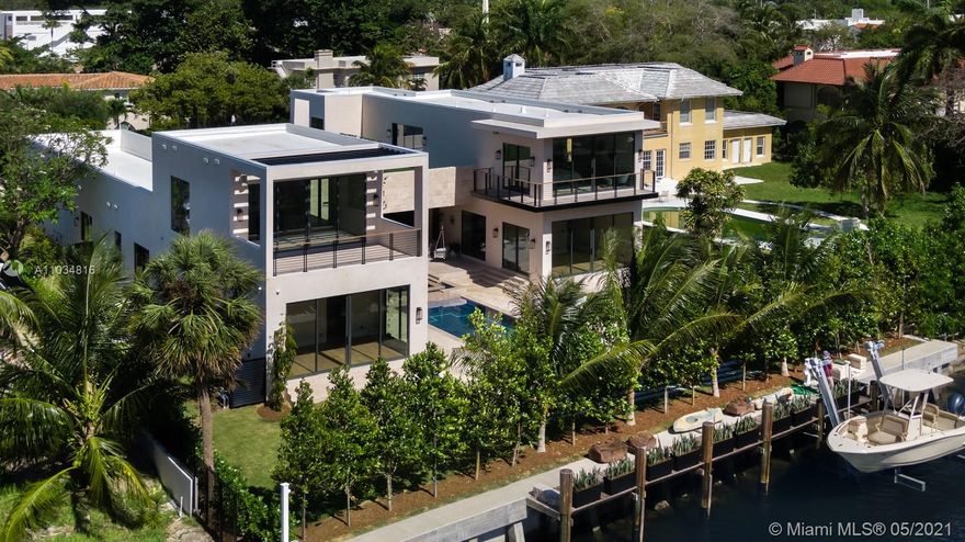 Stunning waterfront 2021 new construction on a huge 19,595 SF lot with 100FT of waterfront on quiet most wanted  Flamingo Dr. This Modern master piece is designed in a unique U- shape form and includes  a 3 car garage/ 8 Bedrooms / 7 1/2 Bathrooms  & 1 Office / Gym with terrace and a 15,000 pound boat lift. Over 7898 gross sqft of space, with Limestone floors throughout the living areas ,Bathroom and terraces combined with Champagne Oak floors for the Bedrooms give this house a natural earth feeling, the Gas equipped kitchen has a 16 feet long Marble countertop and a walk in restaurant style refrigerator which make the kitchen absolutely stunning.The house is located Walking distance from the beach & Lincoln rd mall which make it one of the most desirable locations in Miami Beach.