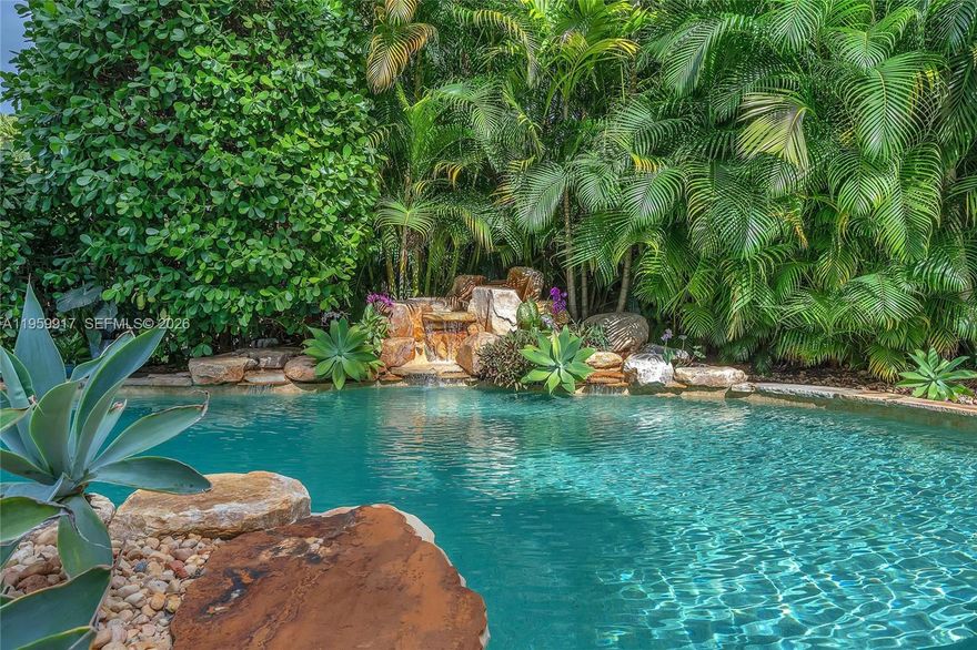 This 3-bedroom, 3-bath pool home with additional private office is located in the prestigious Hollywood Lakes community and offers a rare combination of space, upgrades, and exceptional outdoor living. Set on an oversized lot of over 13,000 sq ft, this unique property on Polk Street also features access from S Northlake Drive.
The expansive primary suite is a true retreat, showcasing a double tray ceiling, recessed lighting, and French doors opening directly to the pool area. The suite includes two walk-in California Closets, a sitting area, and a charming library space—part of the designed primary addition completed in 2017. The primary bath is finished floor-to-ceiling in porcelain tile, accented with quartz in the shower, and includes a heated towel bar.
The home features beautiful terrazzo flooring, impact windows and doors, new interior doors, and plantation shutters. One guest bedroom offers a private en suite, ideal for visitors. The updated kitchen (2017) is equipped w/ custom wood cabinetry, exotic granite counters, mosaic backsplash, SS appliances, and a KitchenAid stove.
Step outside to a fully fenced backyard oasis featuring a saltwater, heated pool with beach entry and waterfall, travertine paver patio, oversized tiki hut, mature mango tree, and professional landscaping—perfect for hosting gatherings or relaxing. Addt'l highlights include parking for 2 cars secured by a rolling gate and locked storage shed. *Roof 2017, 2 HVAC units - 9 yrs old & 2 yrs old*