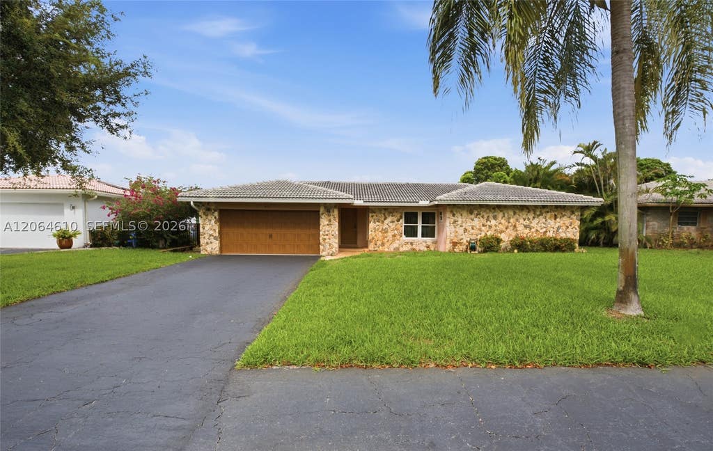 Photo of 821 Ramblewood Dr #821, Coral Springs, FL 33071 (MLS # A12064610)