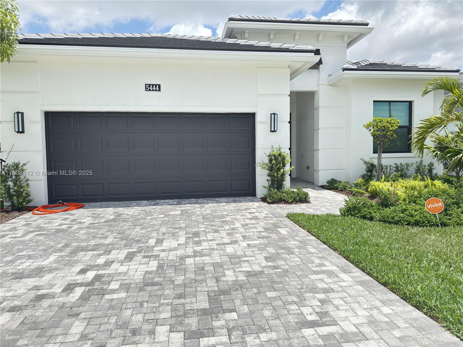 This exceptional residence offers luxurious living in a low-maintenance, resort-style, 1owner 55+. Full upgrades, priced to sell, won't last. Kitchen cabinets up to the ceiling, all closets, wood-made The moment you step inside, you’ll notice the upscale motorized shades and elegant finishes. Lamps not included. Enjoy peace of mind with HOA with yard maintenance, a truly care-free lifestyle. Ideally located near major highways, beaches, and three international airports, this home combines tranquility with unbeatable convenience. Residents enjoy exclusive access to Westlake Adventure Park, featuring resort-style pools, fitness centers, pickleball and tennis courts, and walking trails. Style or simply seeking the best of South Florida living, move-in-ready gem delivers. this one won’t last!