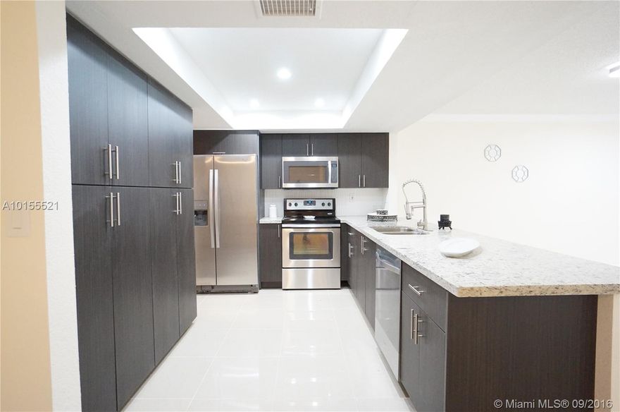 FHA APPROVED,PERFECT FOR 1ST TIME HOMEBUYERS AND INVESTORS!FORGET THE REST AND BRING YOUR PICKIEST CLIENT TO SEE THIS COMPLETELY REMODELED MASSIVE 1 STORY TH WITH OVER 2,000 SQFT OF ABSOLUTE BEAUTY AND ATTENTION TO DETAIL|ALL NEW KITCHEN WITH GRANITE AND BRAND NEW STAINLESS STEEL APPLIANCES,NEW FULL SIZE WASHER & DRYER,NEW A/C|COMPLETELY RENOVATED BATHROOMS|CROWN MOLDINGS|HIGH END PORCELAIN TILES||NO RENTAL RESTRICTIONS!RENT RIGHT AWAY!|ONE CAR CARAGE| SMALL PETS ALLOWED| RARE FIND,WILL NOT LAST!