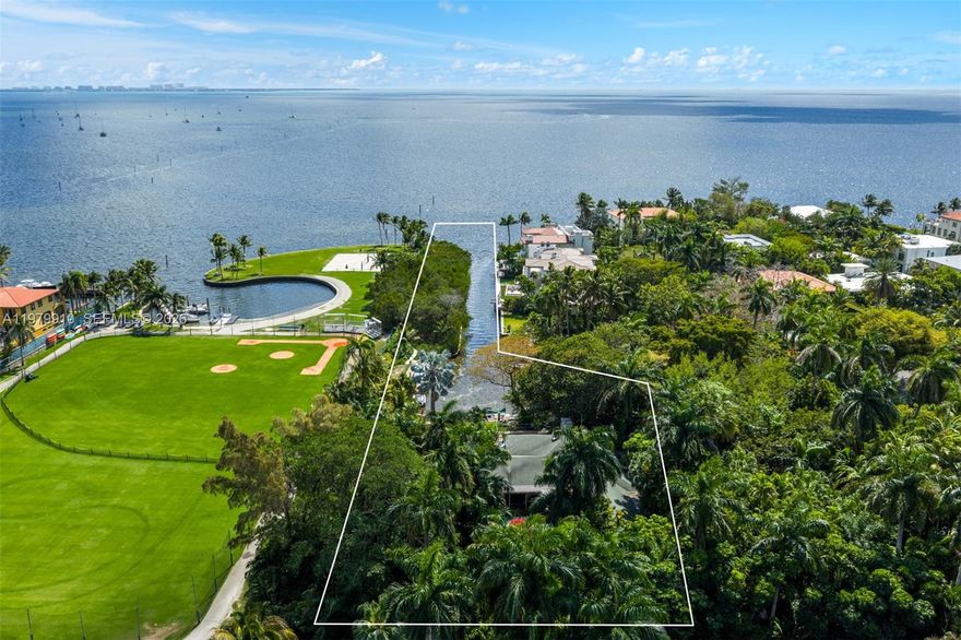 A rare opportunity to create a landmark waterfront estate within the exclusive gated enclave of Four Way Lodge Estates in Coconut Grove. Offered as an expansive ~50,000 SF elevated homesite and an additional ~22,000 SF mangrove preserve, this exceptional property presents a truly unrivaled setting for bespoke new construction. Seamless access to Biscayne Bay and the open ocean, the location affords endless water views. The elevated lot offers a rare advantage for design, allowing for a grand residence with sweeping rooftop terraces and panoramic 360-degree vistas. Surrounded by lush, mature landscaping, the property ensures both privacy and a tranquil natural backdrop. Ideally located just moments from the heart of the Grove, it is within close proximity to premier schools, parks, marinas, and a vibrant selection of dining and retail destination.  An extraordinary offering for the most discerning buyer --envision and build a custom waterfront estate that captures the essence of refined Miami living.