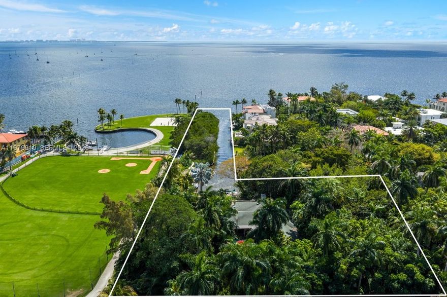 A rare opportunity to create a landmark waterfront estate within the exclusive gated enclave of Four Way Lodge Estates in Coconut Grove. Offered as an expansive ~50,000 SF elevated homesite and an additional ~22,000 SF mangrove preserve, this exceptional property presents a truly unrivaled setting for bespoke new construction. Seamless access to Biscayne Bay and the open ocean, the location affords endless water views. The elevated lot offers a rare advantage for design, allowing for a grand residence with sweeping rooftop terraces and panoramic 360-degree vistas. Surrounded by lush, mature landscaping, the property ensures both privacy and a tranquil natural backdrop. Ideally located just moments from the heart of the Grove, it is within close proximity to premier schools, parks, marinas, and a vibrant selection of dining and retail destination.  An extraordinary offering for the most discerning buyer --envision and build a custom waterfront estate that captures the essence of refined Miami living.