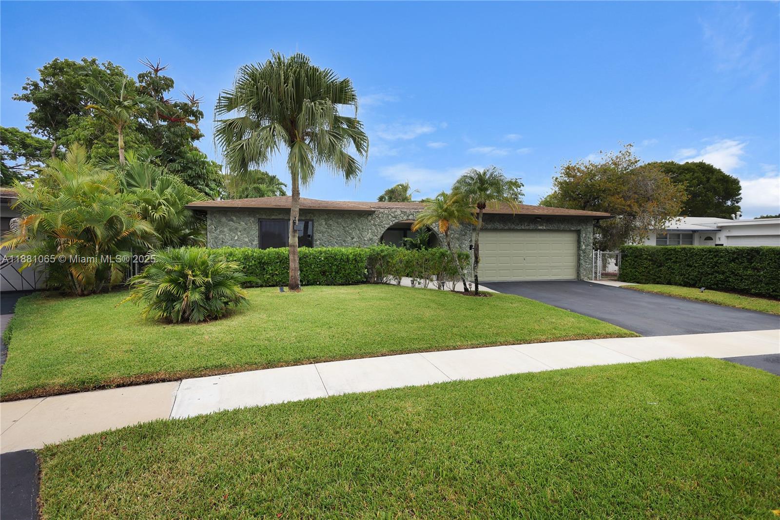 Impeccably maintained 3 bedroom/2 bathroom home seated on an oversized 8,181 sq. ft lot with direct water views. Home is spacious with plenty of windows for natural light. Kitchens and bathrooms have updated finishes including granite countertops. Large fenced-in backyard and a spacious screened porch provides a perfect space for enjoying time with friends and family. No HOA. 2 car garage. Conveniently located near shopping, dining, parks, and major highways with easy access to Fort Lauderdale and Sawgrass Mills. Less than half mile to Bair Middle Community School.