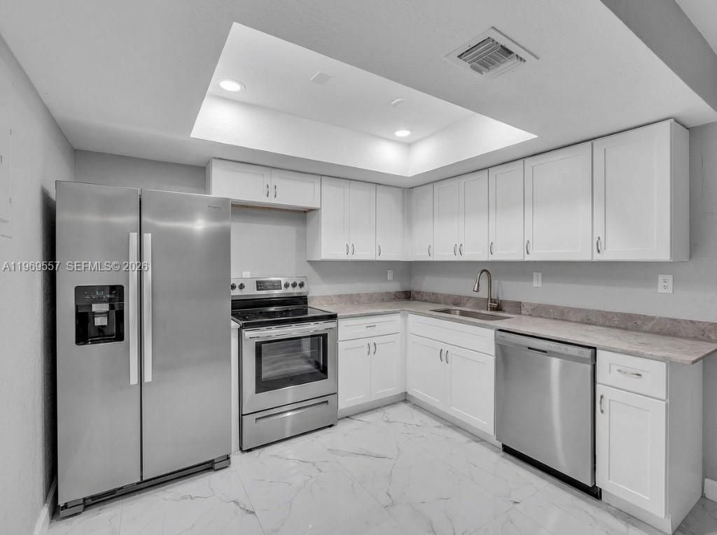 Photo of 34 Meacham Ln, Tamarac, FL 33319 (MLS # A11969557)