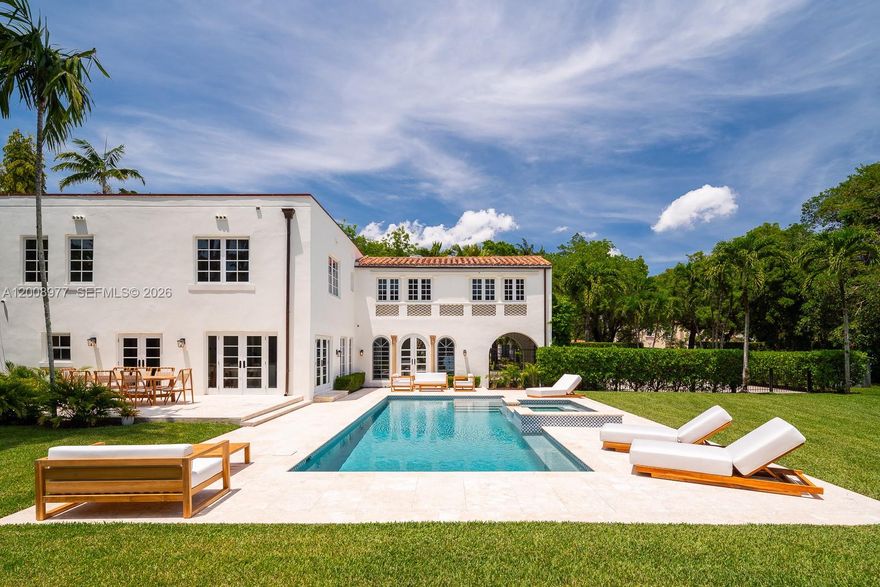 On a vast, park-like half-acre-plus property, this venerable, classic "Old Spanish" style villa—designed by Alexander Dentman and greatly expanded in 1929 by Phineas Paist—offers preserved original charm and character in perfect harmony with its recent professional updating. There is a main two-story residence and a lavish 2-bedroom, two-bath separate guest house. Both structures are fully renovated with impact windows, new bathrooms, chef's kitchen with 6 burner Viking gas range and brand-new Sub-zero refrigerator, new 37' long pool, new landscaping and more. Phineas Paist (1873–1937) was the supervising architect for the Coral Gables Corporation and is credited with shaping the aesthetic identity of Coral Gables, Florida. He was a master of the Mediterranean Revival style, often collaborating with artists like Denman Fink to create iconic public spaces and landmarks. His portfolio includes some of the most recognizable structures in South Florida, many of which are listed on the National Register of Historic Places including Villa Vizcaya, Coral Gables City Hall, Venetian Pool, The Colonnade Building, the Old United States Courthouse and Douglas Entrance. This walled and gated close to 5000 square foot home has 6 bedrooms and 4.5 baths and is located close to The Coral Gables Country Club, Granada Golf Course, the Venetian Pool and is just a 20-minute Uber ride to Miami Internation Airport.