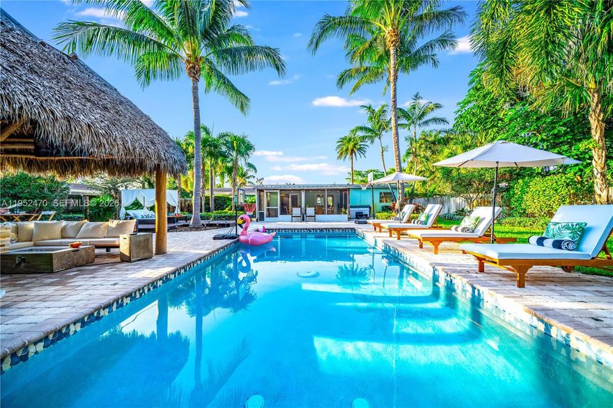 This 4-bedroom, 3-bath home features a split floor plan and open living spaces designed for comfort and flexibility, situated on a rare quarter-acre lot. The fully fenced backyard is a true showstopper with a heated pool, jacuzzi, sunroom, and a complete tiki hut with bar — creating a resort-style experience. Located just 5 minutes from the beach and close to golf courses, dining, and nightlife. Ideal as a primary residence, second home, or investment opportunity with strong income potential.