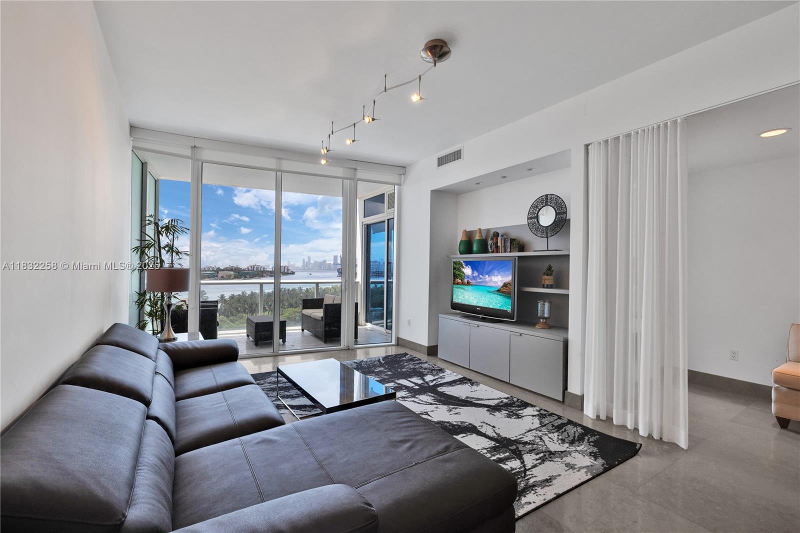 Elegantly designed 1-bedroom, 1.5-bath residence offers stunning views of Biscayne Bay and prestigious Fisher Island. Enjoy captivating sunsets over Downtown Miami from this unique floor plan, which features an open kitchen and living areas perfect for both entertaining and privacy. Highlights include a private elevator foyer, tasteful furnishings, a beautiful primary bedroom with impressive views, and large custom closets. All this is situated within Continuum, a 5-star lifestyle community set in a gated 13-acre enclave.
