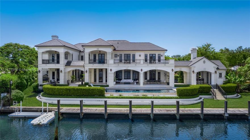 Experience unparalleled elegance in this breathtaking estate located in Old Cutler Bay. Designed by renowned architect Ramon Pacheco and nestled within an exclusive gated community. Enjoy stunning bay views from every room in this masterpiece, updated in 2015. The expansive foyer leads to a chef's kitchen with top-tier appliances and exquisite dining spaces overlooking a spectacular infinity-edge pool. The luxurious master suite, complete with a fireplace, offers a serene retreat. This exceptional estate also features an opulent in-home theater, a four-car garage, a 100-foot dock with direct ocean access, and a full house generator for peace of mind.