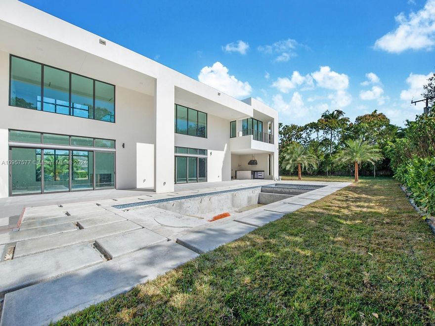 Spectacular Brand-New Construction & nearly ready for occupancy in the heart of Pinecrest. This 2-story modern estate, rests on a spacious 37,897 sf lot offering an exceptional open floor plan spanning 7 beds & 8/1 baths. Welcomed by volume ceilings, enormous imp windows & doors offering plenty of natural light. Discover a modern eat-in kitchen w/Italian cabinets, quartz counters, walk-in pantry, Wolf & SubZero Appl. Enjoy expansive living areas, family rm, dining rm, plus upstairs den/office space. Master suite offers large walk in closet, spa-like bath w/ Grohe shower & separate soaking tub. An outdoor retreat awaits w/extravagant resort style pool/spa & summer kitchen on expansive green grounds. Other feat: maid’s quarters, quiet street & elite Pinecrest Schools. 1-year builder’s warr.