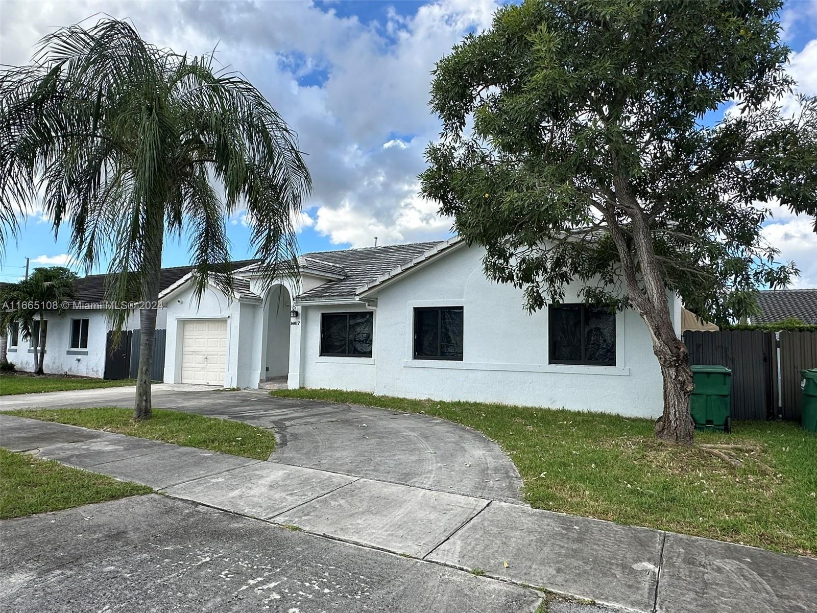 This beautifully maintained 4 bedroom 2 bath home in Monaco Estates features an inviting entryway directing you to the tiled living and dining areas with volume ceilings throughout. The spacious white kitchen features a large breakfast area and bar counter area. The family room passes to the oversized outdoor covered patio with quality awning. The Great backyard will provide the luscious sweet stringless VanDyke mangoes! Both sides of the house have entrances to the patio, Also featuring The Garage can be used as an extra Room, New stainless steel appliances. perfect for a large family. Come visit your future home.