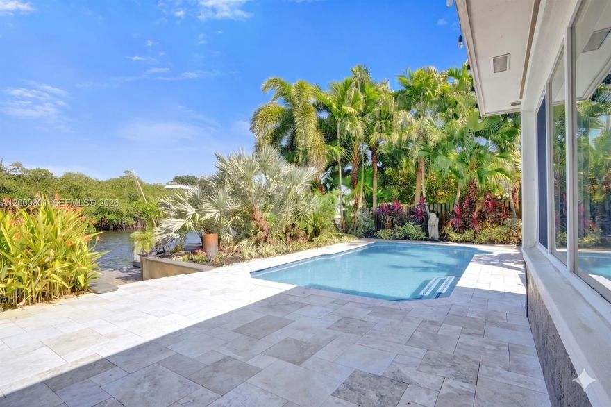 Tucked away in one of Wilton Manors’ most private waterfront lots, this beautiful home offers total tranquility w/ serene canal & mangrove views and no neighbor across the water! Featuring great curb appeal w/ large semi circle driveway, lush mature landscaping & cozy covered front porch. Inside you have large porcelain tile floors, impact windows/doors throughout, bright Florida room, guest room, & home office all w/ direct water views. Outside this home shines w/ multiple seating/entertaining areas, covered lanai, hot tub/spa, 30 foot dock w/ocean (fixed bridges)  access, & heated pool. New A/C, Tankless WH, Dock Bumpers, & Ladder, full size washer and dryer, one car garage plus parking for 4 more cars.  Lighting, Lanai & Back Patio w/ Travertine Pavers.  Prime tranquil location near easy walk to Wilton Drive.