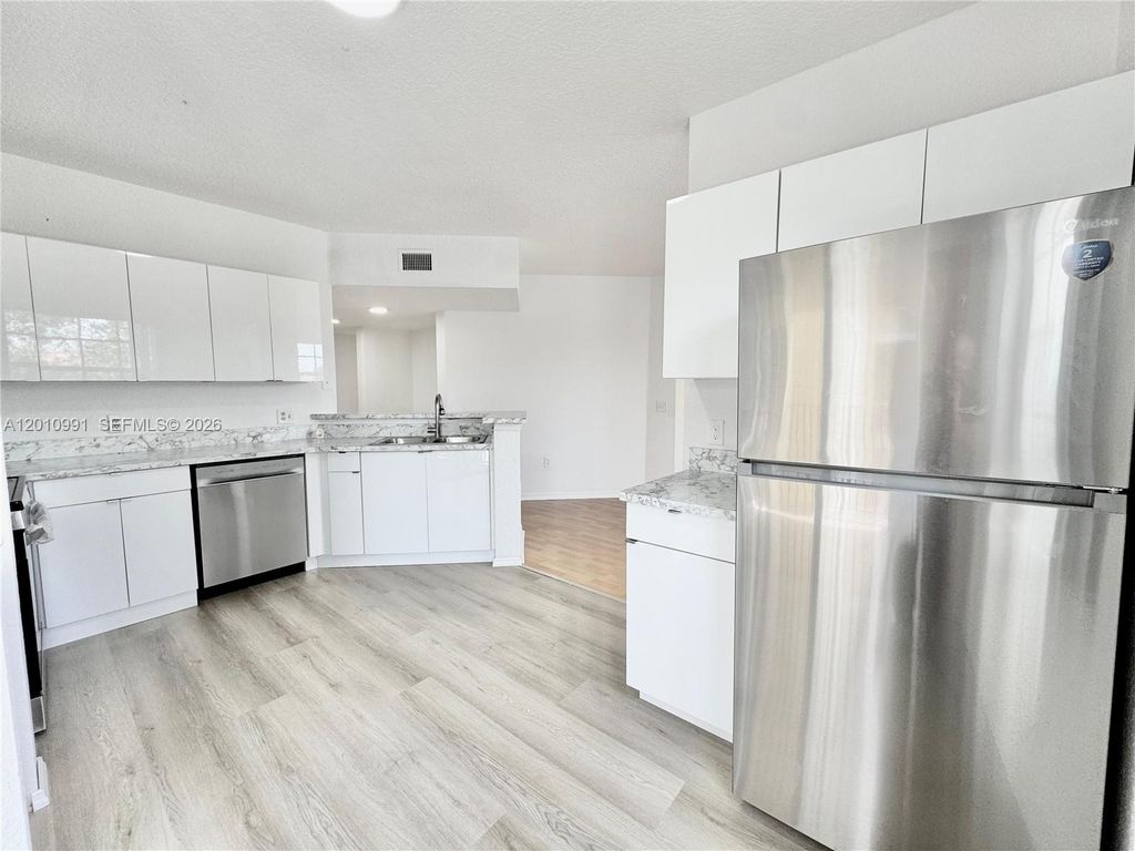 Photo of 2311 Belmont Ln #2311, North Lauderdale, FL 33068 (MLS # A12010991)