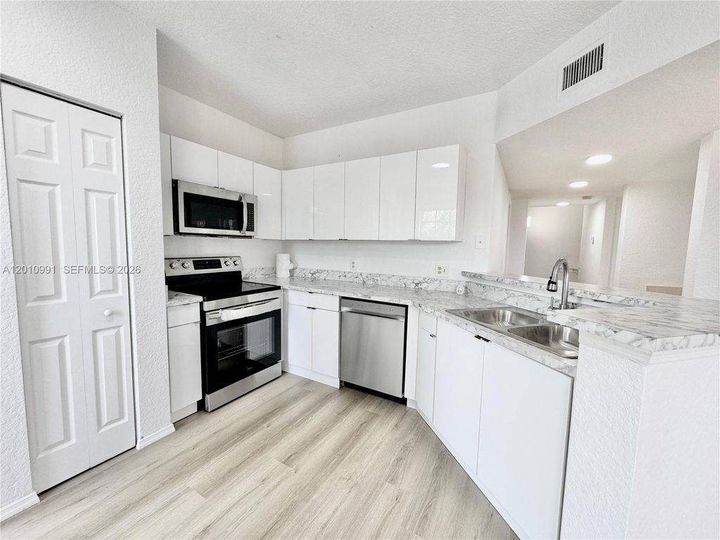 Photo of 2311 Belmont Ln #2311, North Lauderdale, FL 33068 (MLS # A12010991)