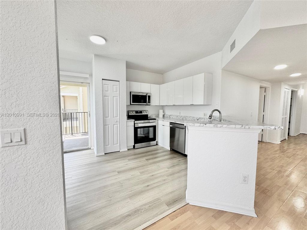 Photo of 2311 Belmont Ln #2311, North Lauderdale, FL 33068 (MLS # A12010991)
