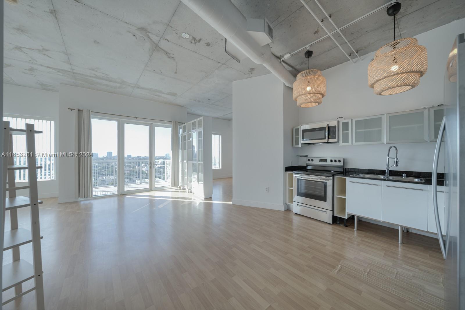 Expansive 2-bedroom open loft in Historic Riverside with Brickell and Downtown skyline views. The open loft interior comprises over 1000 SF of interior living space with 9-foot ceilings and a spacious open kitchen with custom Italian cabinetry. The washer, Dryer, A/C, and water heater have been upgraded within the past two years. Includes 1 assigned parking space and additional outdoor storage. Central to Downtown Miami, Little Havana, Coconut Grove, and Brickell City Center with direct access to I-95. Amenities include a gym, infinity-edge lap pool, sauna, tennis court, meditation garden, dog park, clubhouse, business center, gourmet Spanish restaurant Jamon Iberico Pata Negra, 24-hour concierge, and valet. Seller will contribute 50% to special assessment.