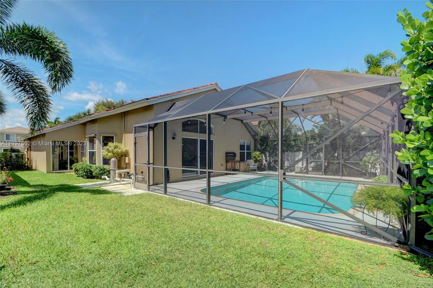 Situated in Prairie Dunes Village of desirable Winston Trails, this single story pool home offers a spacious floor plan with vaulted ceilings and natural light, 20" Porcelain tile in main rooms, wood grain laminate floors in bedrooms with upgraded moisture/sound proof underlayment, ceiling fans and a split floor plan. Upgraded bathrooms, new impact front door, new HVAC and ducts, open kitchen with an island and granite countertops. Screen pool patio great for entertaining. Amenities include an Olympic size temperature controlled pool, 6 tennis courts, an active tennis program, 2 pickle ball courts, a 2 mile long walk/bike path and fitness park. The non-equity Public Golf Course, 24 Hour manned gate and a Kids play area. Membership is NOT required. It is South Florida Living at It's Best!