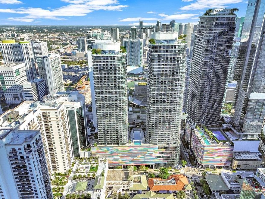 This 7,279-square-foot, Class A office space is located on the fifth floor of Brickell Heights Building, offering a modern, flexible layout with high ceilings (11’8) and expansive windows that fill the space with natural light. Currently operating as a co-working space, the property is income-generating and presents an excellent opportunity for investors, owner-users, and co-working operators. The office includes 10 dedicated parking spaces with valet service and is situated in a luxury mixed-use building designed by Rockwell Group & Arquitectonica, featuring top-tier amenities such as Equinox, SoulCycle, and direct parking access.
