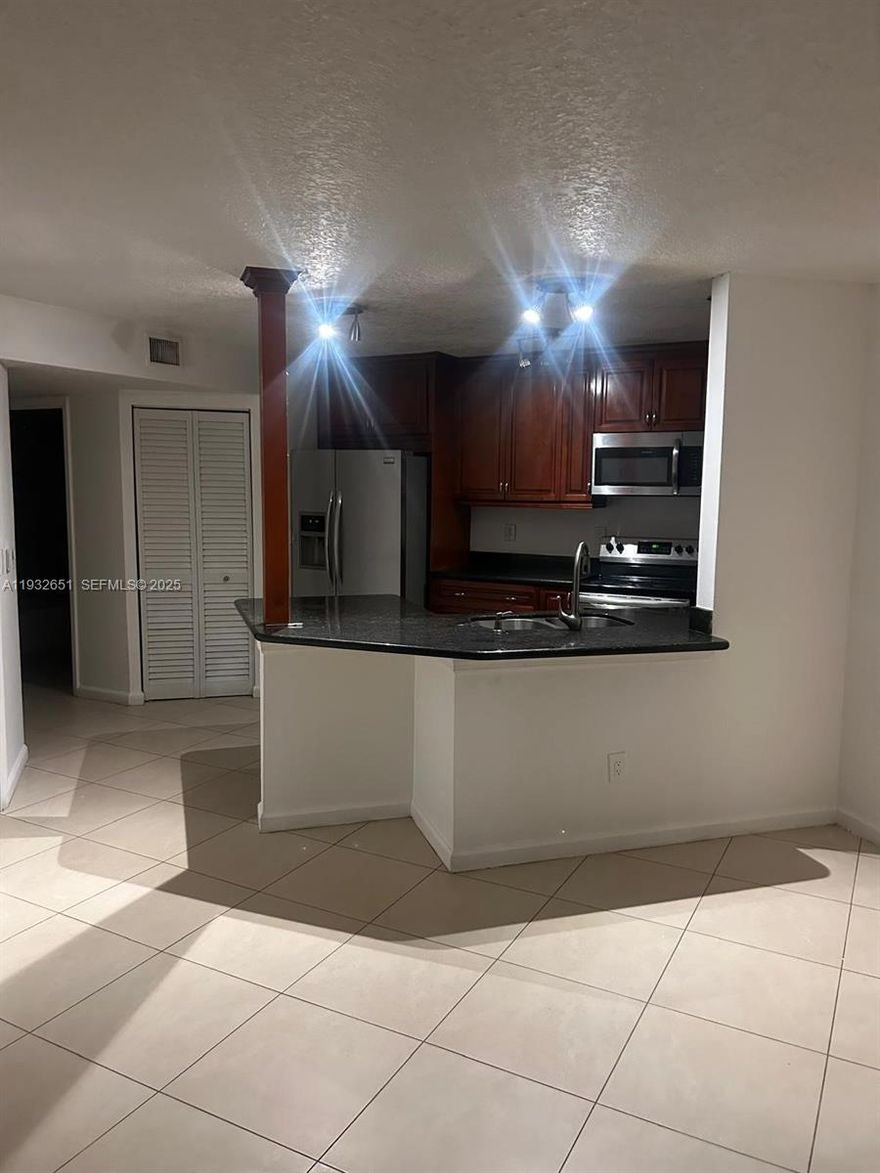 Updated three bedroom condo in Pompano Beach community of Windward Lakes. Kitchen features Cherry Wood cabinetry, granite countertops and stainless steel appliances.  Both baths feature updated shower tiling, wood vanities and granite tops. Full size washer & dryer in a separate laundry room.  Located close to major highways, shopping, restaurants and Fort Lauderdale airport.