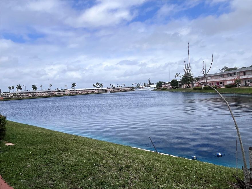 Rarely available! 1st floor unit overlooking beautiful "Rolen Lake." Unit comes ready and is priced perfectly for its new owner to construct and decorate with their own personal taste. Laundry in building. Live the dream year-round or have the perfect vacation get-away. Community boasts heated pool, walking path, shuffleboard, and more