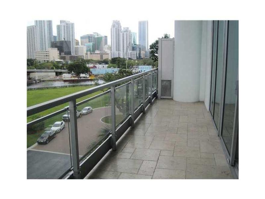 Condo living in a private townhouse.  Pull into your 2 parking spaces on the same floor as the entrance to your doorstep and still enjoy all the amenities of high rise condo living.  No elevators needed.  Great views of the Miami River and the City from y our ample balcony.  This gorgeous 2 story, split level townhouse features 2 full baths, one upstairs and one downstairs.  The master bedroom upstairs has room for an office.  Downstairs you can keep the open floor plan or close of to add the second br.