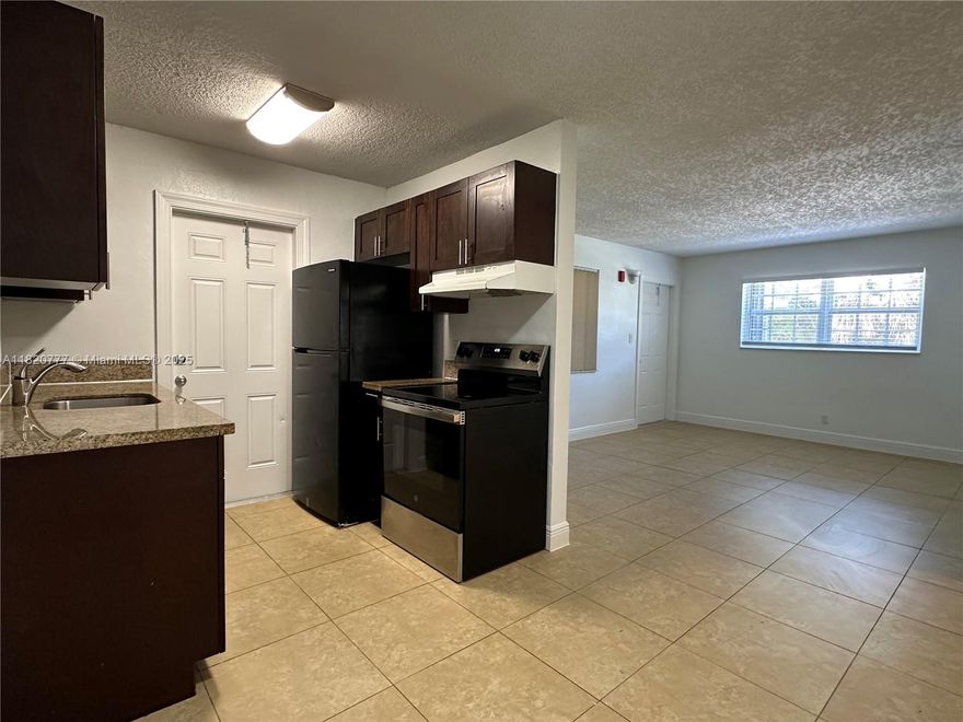 LARGE, SPACIOUS and newly updated 2 bed/1 bath apartment in Pompano Beach!!! Charming 1st floor, corner unit with beautiful tile floors, granite countertops, wooden cabinets, impact windows, walk-in closets and central AC. Plenty of natural light throughout! Huge living and dining area. Upgraded appliances. Located in a gorgeous, well-maintained, gated complex with plenty of amenities such as a sun deck, garden area, BBQ / picnic area, community pool and full laundry room on-site. Private community with security patrol. Water, waste, sewer, maintenance, pest control + 1 assigned tandem parking space included in rent. Pets welcome. Property is in a great area - tucked away on a quiet street in a pretty neighborhood yet close to all of the major highways, shops, restaurants, schools & parks.