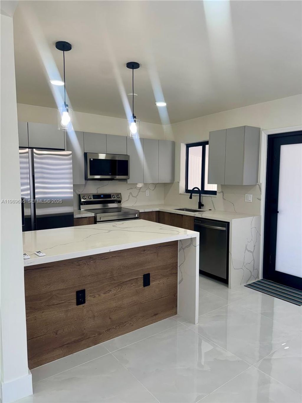 Photo of 740 NE 43rd Ct, Deerfield Beach, FL 33064 (MLS # A11989635)