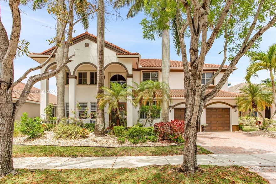 Breathtaking Lakefront Residence in Savanna Welcome to this rare and exquisite lakefront home located in thehighly desirable, resort-style community of Savanna in Weston. From the moment you arrive, you’ll be captivatedby the home’s grand entryway, featuring three striking arches framed by majestic Royal Palms. This home is trulya showstopper. This immaculate two-story residence features a luxurious master suite with a private retreat. Thereare five additional spacious bedrooms and five full bathrooms. The correct square footage is 4214 Enjoy an open-concept layout designed for both elegance and comfort. Step outside to your own private oasis—a sparkling poolwith a relaxing spa, perfect for entertaining or unwinding. Enjoy this exceptional community and its A ratedschools.