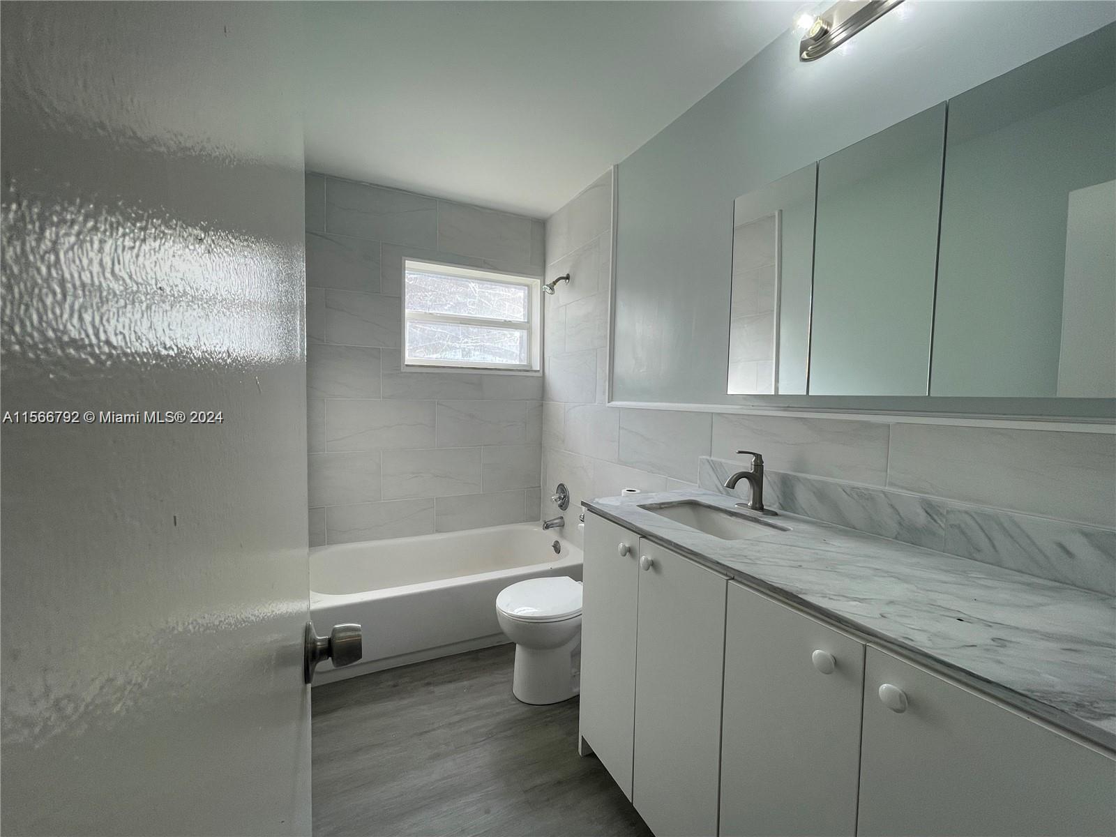 Welcome to your spacious haven! This updated 3-bedroom, 2-bathroom gem boasts a laundry room, fenced backyard, and a large private driveway. Say goodbye to lawn care worries – it's included! Conveniently located near highways for easy commuting. Don't miss out on this perfect blend of comfort and convenience!