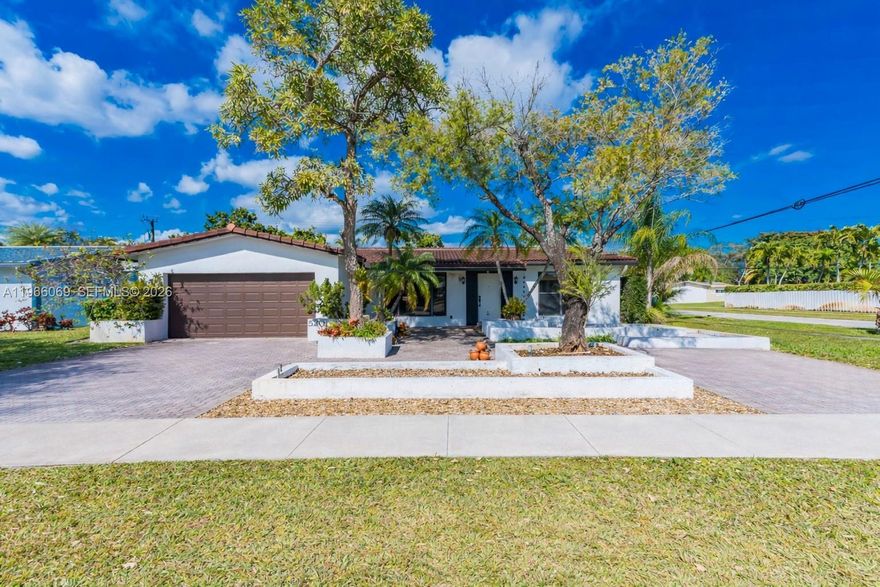 RARE CORNER LOT!! Beautiful 3-bedroom, 2-bath home situated on an OVERSIZED, fully fenced in corner lot with a heated pool in a prime location. This property features COMPLETE IMPACT WINDOWS AND DOORS, Newer Barrel Tile Roof (2019), Newer A/C (2021), New tile flooring, 2-car garage, 2-car driveway, and a rare additional concrete slab along the rear side of the property with easy side-gate access, a true boater and RV enthusiast’s dream! Perfect for storing boats, RVs, or trailers with convenient in-and-out access, plus the potential for additional parking income. The thoughtfully designed layout offers spacious living and dining areas and a large kitchen with eat-in space. The  backyard feels like a private retreat, complete with a covered patio that opens to the pool and generous yard space. The expansive primary suite includes a large walk-in closet and a spa-style bathroom with dual sinks, separate shower, and whirpool tub. Ideally located next to a park, less than 10 minutes to the beach, and close to major highways, major airports, shopping, and dining - a one of a kind property in the heart of Hollywood!