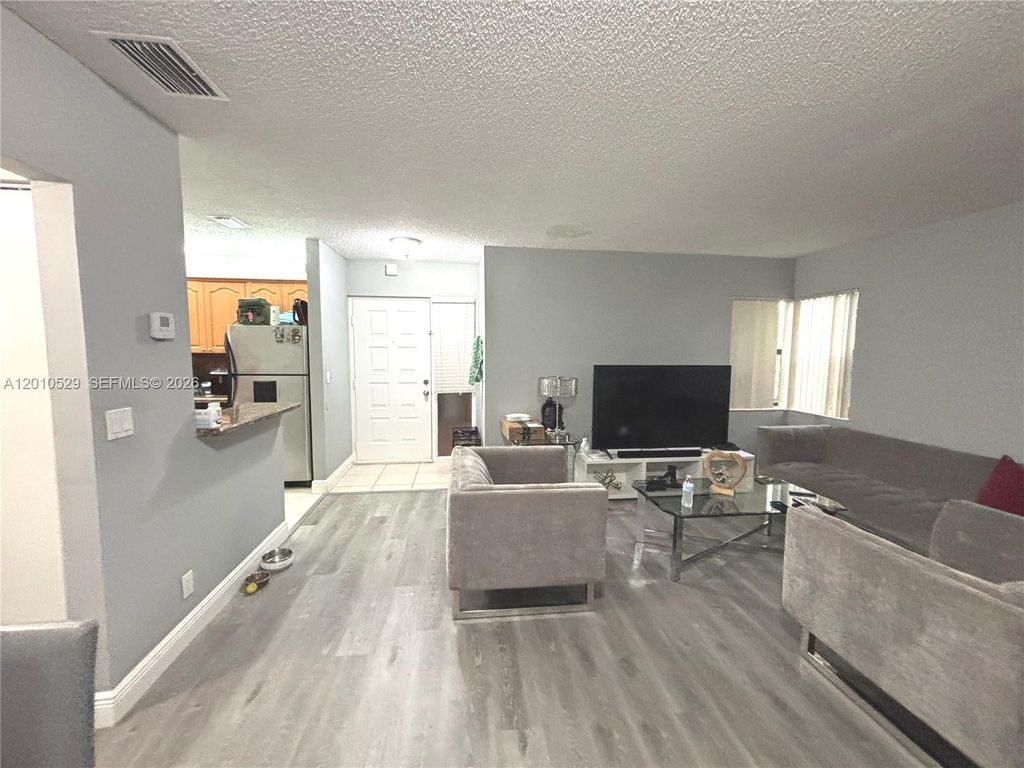 Photo of 3859 Coral Tree Cir #308, Coconut Creek, FL 33073 (MLS # A12010529)