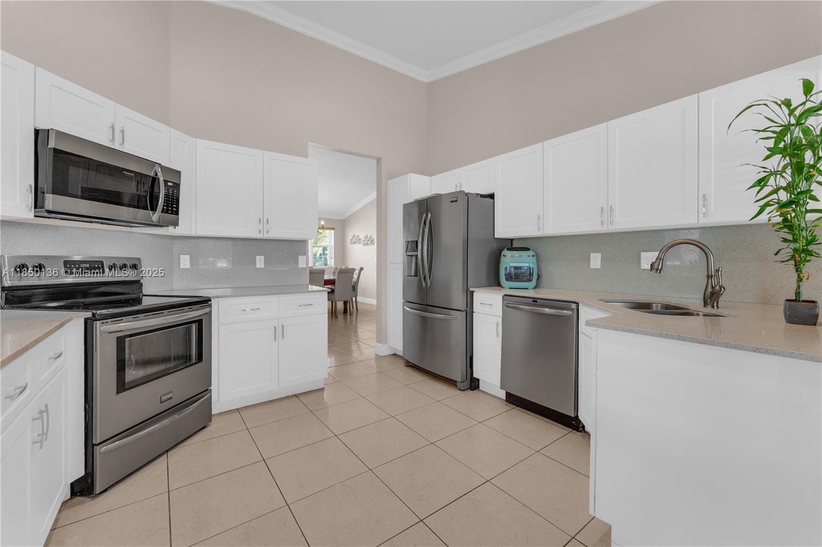 Welcome home to this beautiful 5-bedroom,3-bath single-story home in desirable Picket Fences subdivision in Homestead! Built in 2004, this spacious residence offers vaulted ceilings & abundant natural light throughout. Enjoy an open floor plan with generous living areas & a recently remodeled kitchen featuring white cabinetry, quartz countertops & S.S Appliances. Tile flooring flows through the main areas+ ceramic wood like tile in the bedrooms for added comfort. All bathrooms are well kept & each bedroom offers ample space! Sitting on an oversized 8,625 sq.ft. lot with canal views, this home boasts a large driveway that accommodates up to 6 vehicles—perfect for guests or a growing household. NO HOA! A rare find combining comfort, space, and convenience—schedule your tour today!