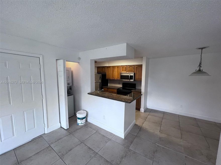 SPACIOUS 2 BEDROOM 1 BATH CONDO IN POMPANIO BEACH IN GATED COMMUNITY. LOCATED OFF OF TURNPIKE BETWEEN COMMERICAL BLVD AND ATLANTIC BLVD, EASY ACCESS TO EVERYTHING ! UNIT COMES WITH NEW CENTRAL AC, STACKABLE WASHER DRYER, ALL TILED AND GRANITE COUNTERTOP. GREAT FOR FIRST TIME HOMEOWNER OR INVESTORS IF LOOKING FOR RENATL PROPERTY.