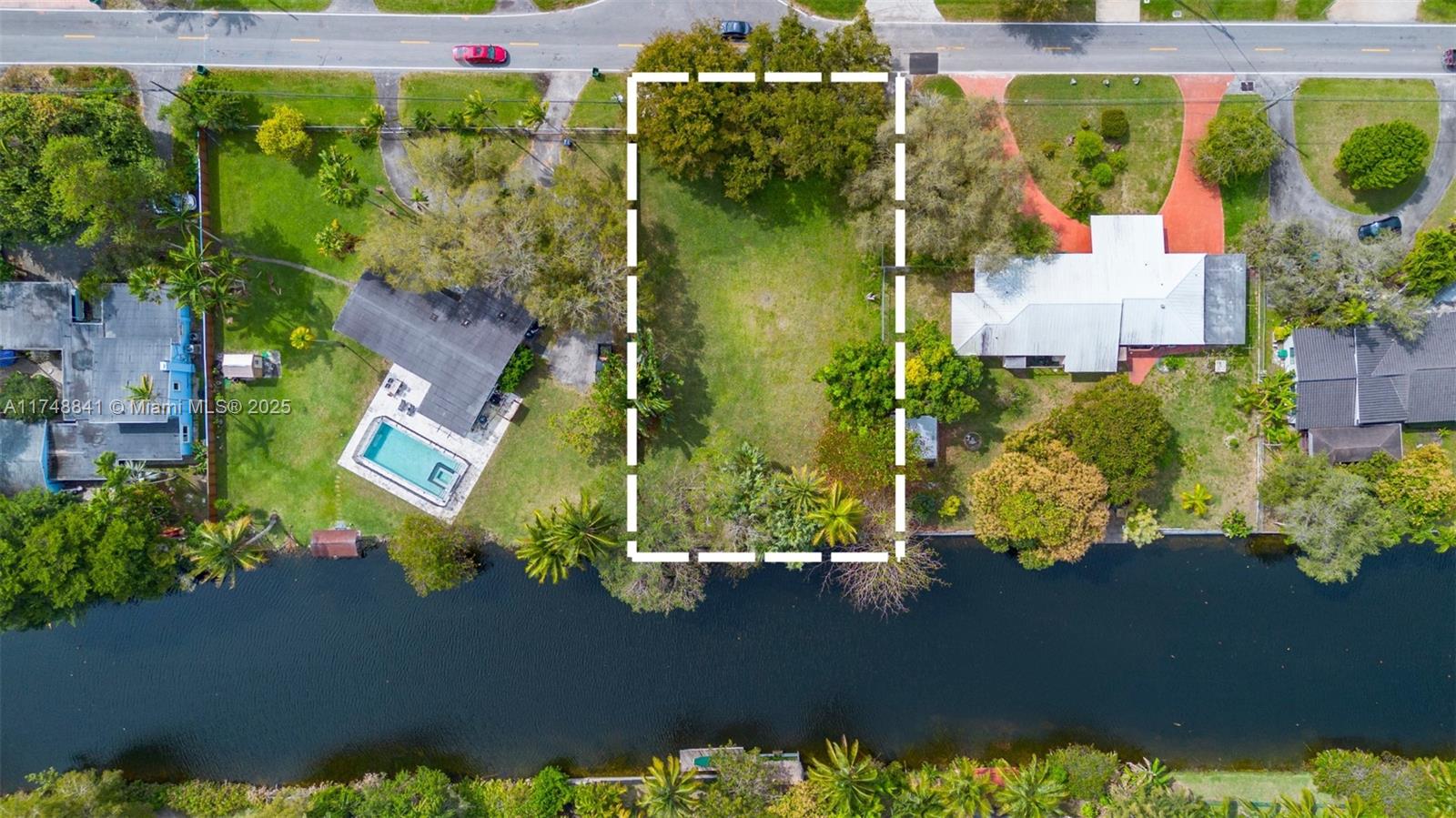 Priced to sell, one DOUBLE canal front lot, many unique options. Whether you are looking to build your dream tropical home with approved plans or you are an investor / developer, this large 15,200 SF piece of land boasts: 7 ft above sea level, soil tested, good conditions sea wall, potential to divide lot to build 2 single family homes, perfectly located between Miami Shores and Biscayne Park under unincorporated Miami Dade, which allows lucrative short term rentals potential. Location could not be better, right by Country Dade school, Barry University, few minutes from Design District, MIA, Miami Beach, Downtown/Brickell, yet very quiet residential area.