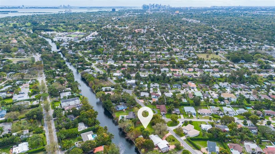 Build your dream home, or use already ALREADY APPROVED plans. This expansive 15,200 SF lot sits approximately 7 feet above sea level and has been soil tested, offering a strong foundation for future development. The property features a seawall in good condition. Ideally positioned between Miami Shores and Biscayne Park within unincorporated Miami-Dade County, it allows for lucrative short-term rental potential. The location is truly unbeatable—just steps from Miami Country Day School and Barry University, and only minutes from the Miami Design District, Miami International Airport, Miami Beach, and Brickell. Despite its central proximity, the property is nestled in a quiet, residential neighborhood, offering the perfect balance of convenience and tranquility.