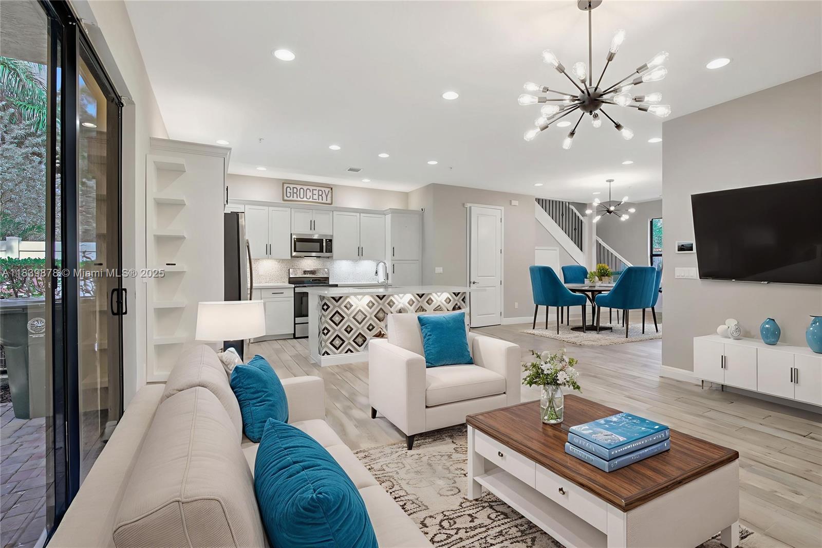 Welcome to this stylish corner townhome in the sought-after gated community of Chapel Grove. Built in 2019, this 3-bedroom, 2.5-bath beauty offers peace of mind w/ full hurricane impact protection. Step inside to discover a crisp, modern kitchen featuring a large island that flows seamlessly into the spacious family room—perfect for lively gatherings or quiet evenings at home. Designer tile & lighting add an artistic flair, making this kitchen truly stand out. Upstairs, you’ll find all bedrooms thoughtfully arranged for privacy and comfort, while sleek bathrooms showcase contemporary finishes. The garage has been partially converted into a flex office area but can easily revert to a full garage. Outside, a cozy private patio invites morning coffee or an evening unwind.