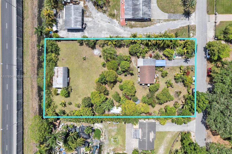 RARE FIND IN S/FLORIDA!! ACREAGE, CUTE COTTAGE, NUMEROUS TROPICAL FRUIT TREES IN THE CITY OF DAVIE!! Your chance to own a piece of the few remaining acreages in S/Fl. Property is fenced and backs up to the New River Canal. The land is R3 zoning with possible agricultural mixed use. Lots can be subdivided. This cottage has solid bones. Roof, impact windows, water heater, ac, electrical wiring all new in last 5 yrs, all legally permitted. The icing on the cake is the over 70 tropical fruit trees. mangoes various varieties (over 30 trees), apples, avocadoes, breadfruit, ackees, lychees, naseberry... easier to name what isn't here. Great property tax savings if organized as a farm. Full list of trees n plants attached. NO HOA. Property is 2 mins from Fl Turnpike, 12 mins from FLL Airport.