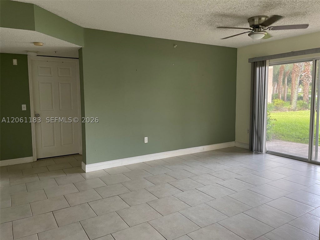 Photo of 5005 Wiles Rd #102, Coconut Creek, FL 33073 (MLS # A12061183)