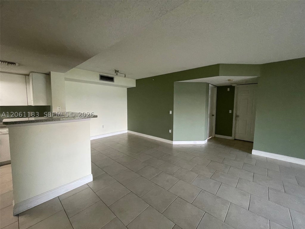 Photo of 5005 Wiles Rd #102, Coconut Creek, FL 33073 (MLS # A12061183)