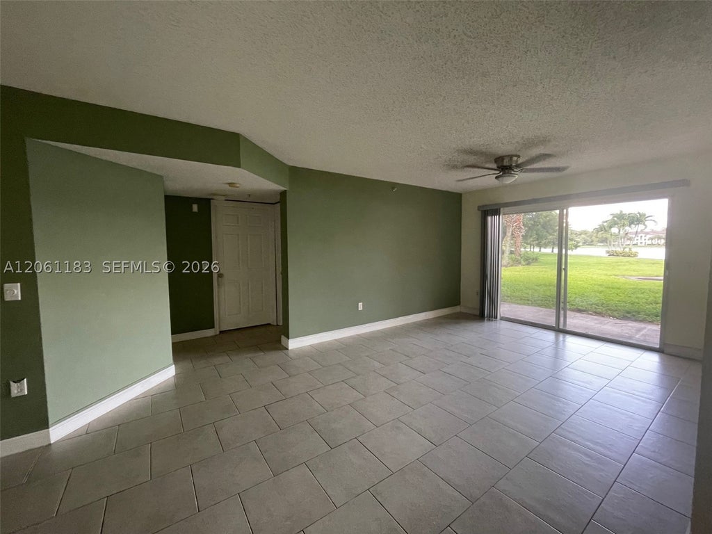 Photo of 5005 Wiles Rd #102, Coconut Creek, FL 33073 (MLS # A12061183)