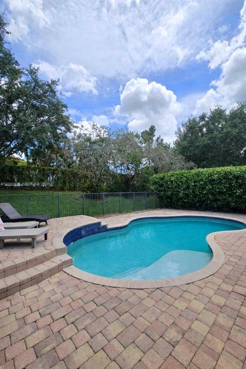 Photo of 11354 Millpond Greens Dr, Boynton Beach, FL 33473 (MLS # A12002833)