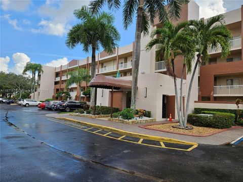 Photo of 7730 Granville Dr #202, Tamarac, FL 33321 (MLS # A11871837)