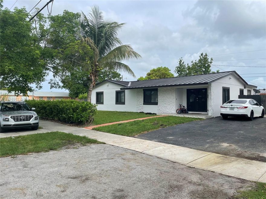you have to come take look at this totally updated 3 bedroom 2 bath house with den. Gorgeous new metallic modern style roof installed recently, new impact windows, corner house with plenty of yard space. 2 sheds in gated backyard, den that can serve as an office space, new central ac. new washer and dryer, gas stove and water heater.